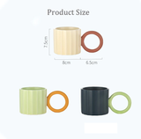 Handmade Ceramic Coffee Mug: Green with Orange Handle