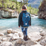 child walking along river side.