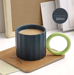 Handmade Ceramic Coffee Mug: Green with Orange Handle